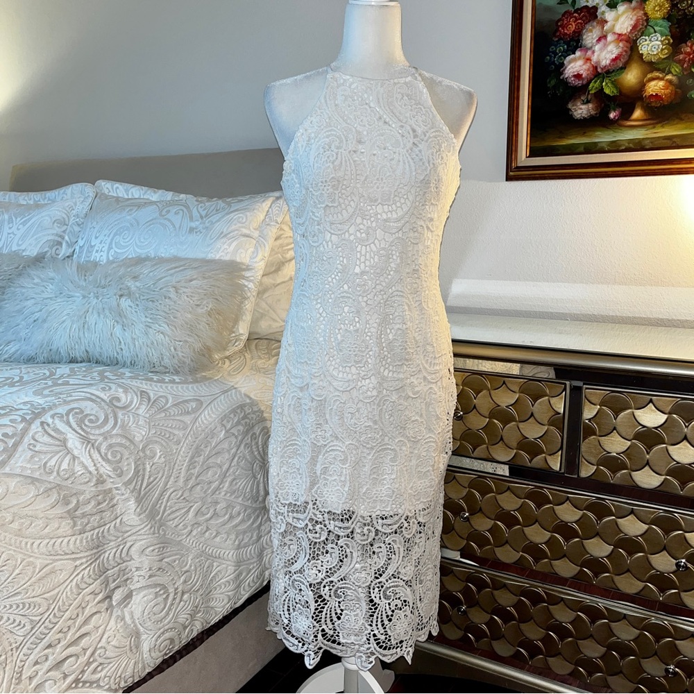 Charlotte Russe white lace form fitting halter type shoulder dress. Size Medium